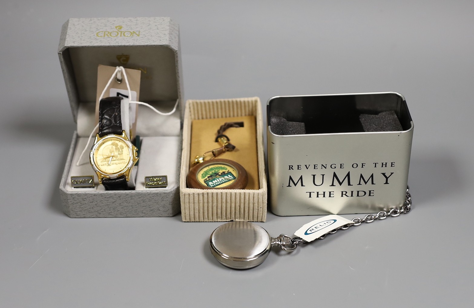 Walt Disney World - gentleman's wristwatch, one Walt Disney pocket watch and one Universal Studio's pocket watch given as gift of opening day of Revenge of the Mummy ride